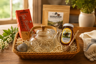Tea Gift Basket with glass teapot, honey, tea biscuits, and Guilford Roasting Company tea